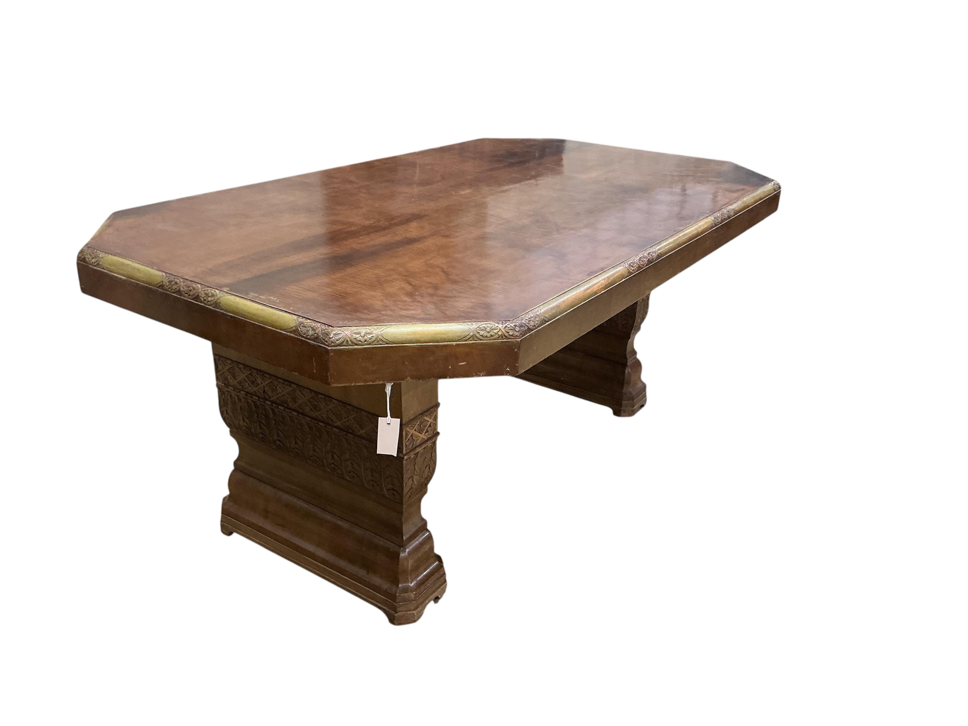 An Art deco walnut dining suite, comprising: dining table, width 190cm, depth 110cm, height 80cm together with eight chairs (two being carvers) and a bow front sideboard